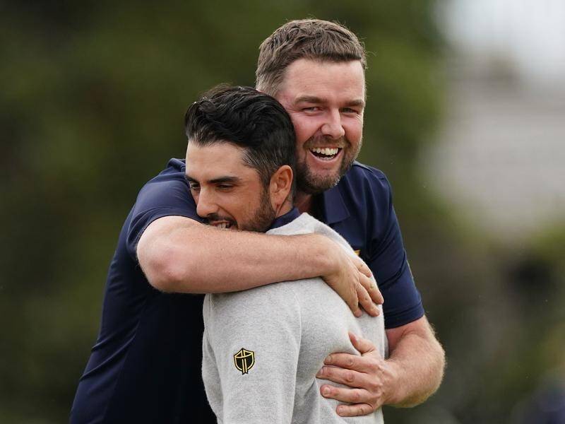 Marc Leishman (R) and Abraham Ancer have charged late to draw their Presidents Cup foursome tie.