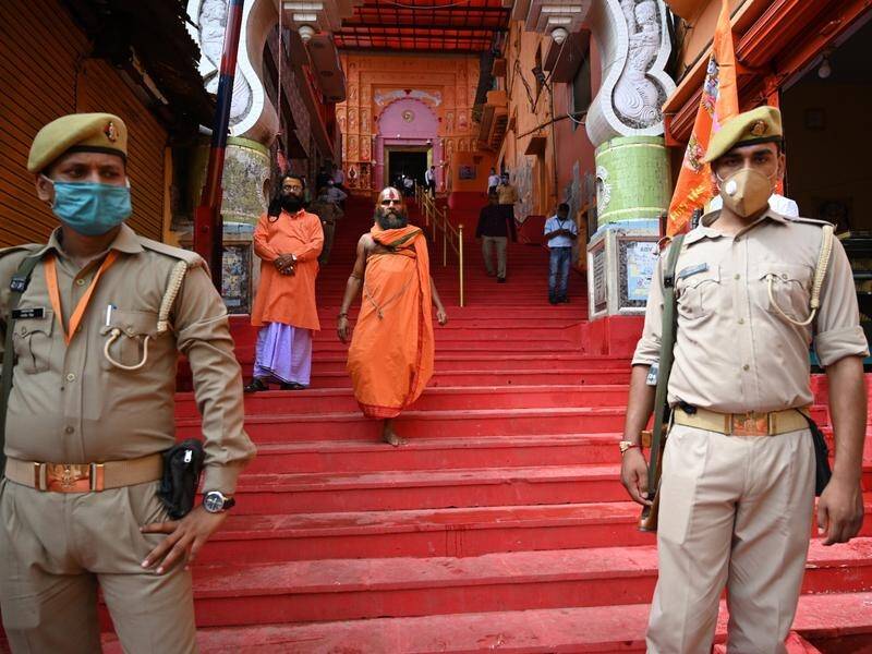 Police stand guard ahead of Indian PM Narendra Modi's arrival in Ayodhya to launch a Hindu temple.