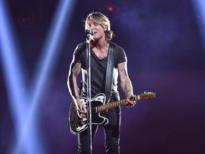 Keith Urban performs Never Comin' Down at the CMA Awards, where he was named performer of the year.