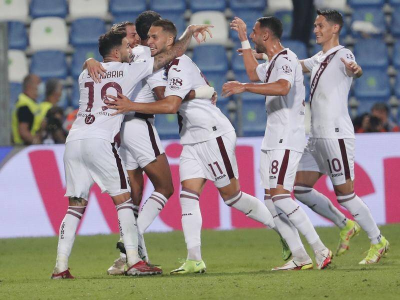Torino's Marko Pjaca (c) celebrates with teammates after scoring in their 1-0 win over Sassuolo.