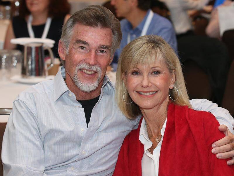 Olivia Newton-John and husband John Easterling are moving their charity to the US.