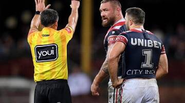 Jared Waerea-Hargreaves of the Roosters (c) is sent to the sin bin by referee Gerard Sutton.
