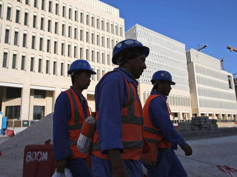 Qatar is pledging to fully eliminate a labour system that ties workers to their employer.