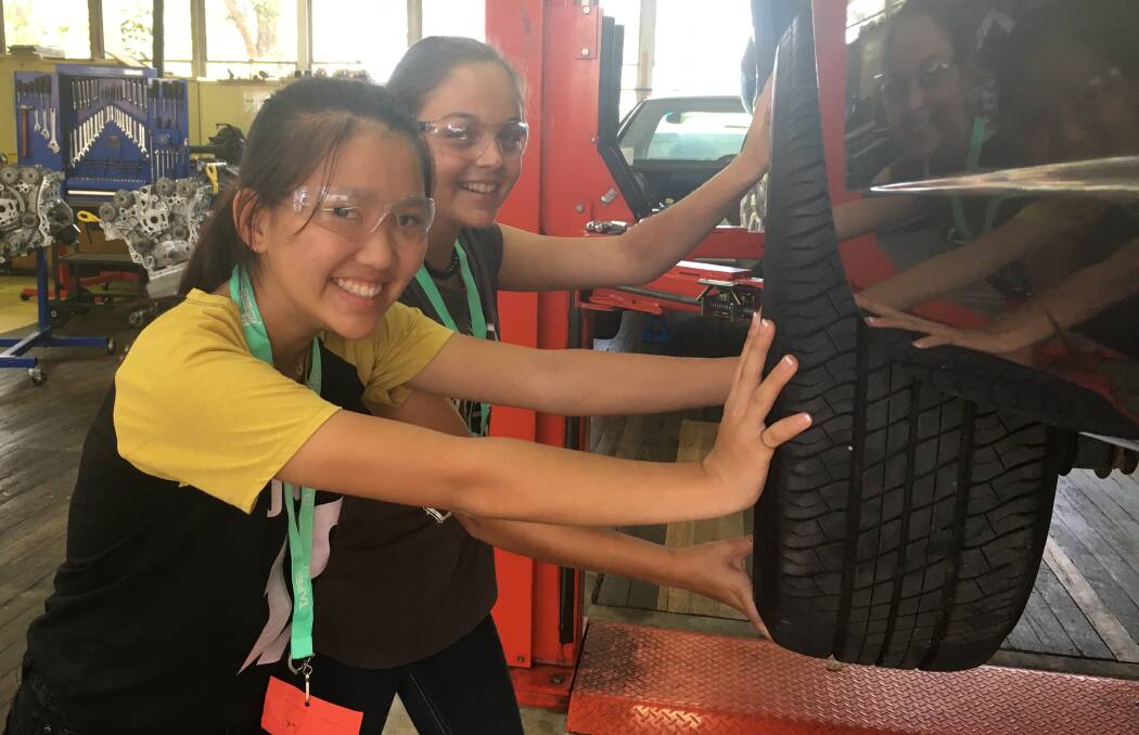 Students participating in the automotive workshop. Photo: Supplied 