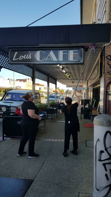 Jacoba Rudder and Sarah Fry have spent the last few weeks undertaking various roles at Lou's Cafe in West Kempsey. Photo: Supplied 