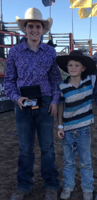 Levi Ward receiving a trophy buckle from Tyler Britten (Son of Josh and Tiarna Britten - Grandson of Colin and Anne Britten from Summer Island Rd, Smithtown). Photo: Supplied 