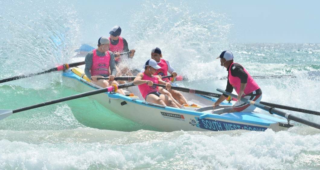 Wave cutting: The South West Rocks Surf Boat's crew competing at the NSW Country Championships in 2017. Photo: Penny Tamblyn.