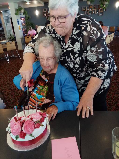 Nellie with her niece Beverly, cutting the cake. Photos: Supplied 