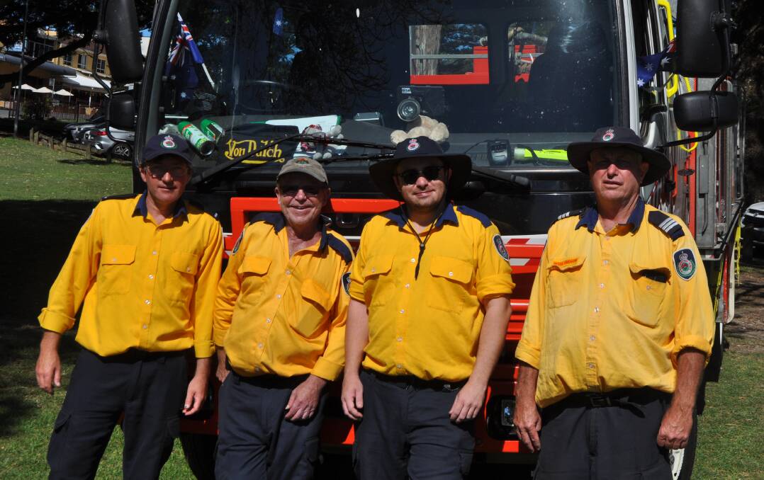 Firefighters Bryson, Doug, Ben, and Brigade Captain Ross were out and about for Australia Day. Photo: Stephen Katte