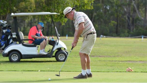 CONCENTRATE: A golfer prepares to putt at the Kempsey Golf Club. Photo: File