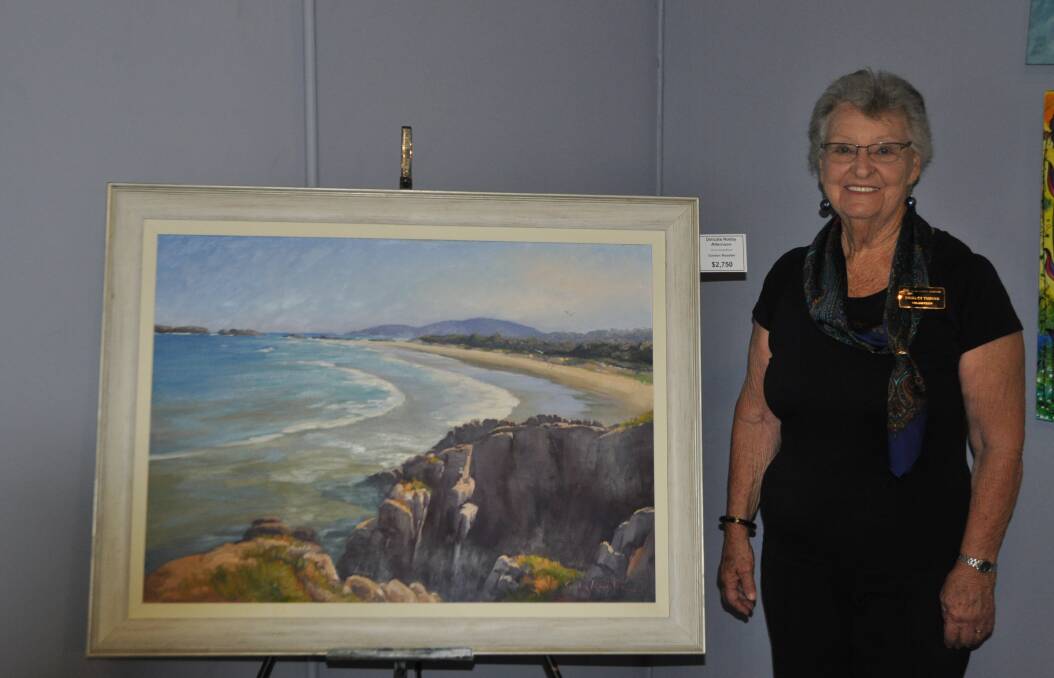 Shirley Thring with the painting Delicate Noby Afternoon by Gordon Rossiter. Photos: Stephen katte 