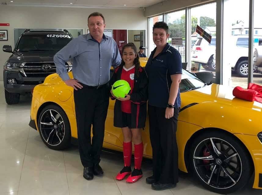 Dealer Principal Michael Briscoe with Rep Player Georgia and New Car Manager Catherine O'Dell. Photo: Supplied 