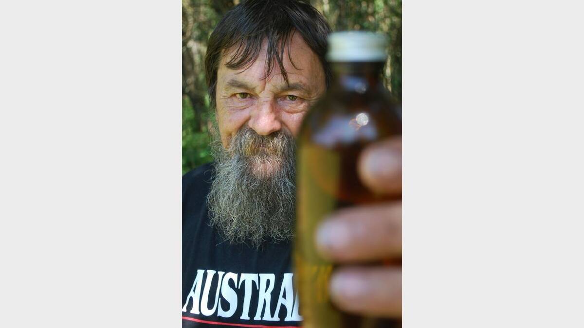 Tony Bower with an empty bottle of cannabis tincture.