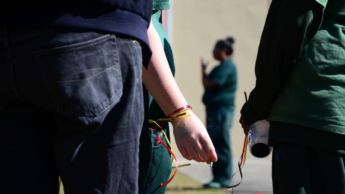 Inmates at the Mid North Coast Correctional Centre in Kempsey have a smoke before a smoking ban is enforced on Monday 