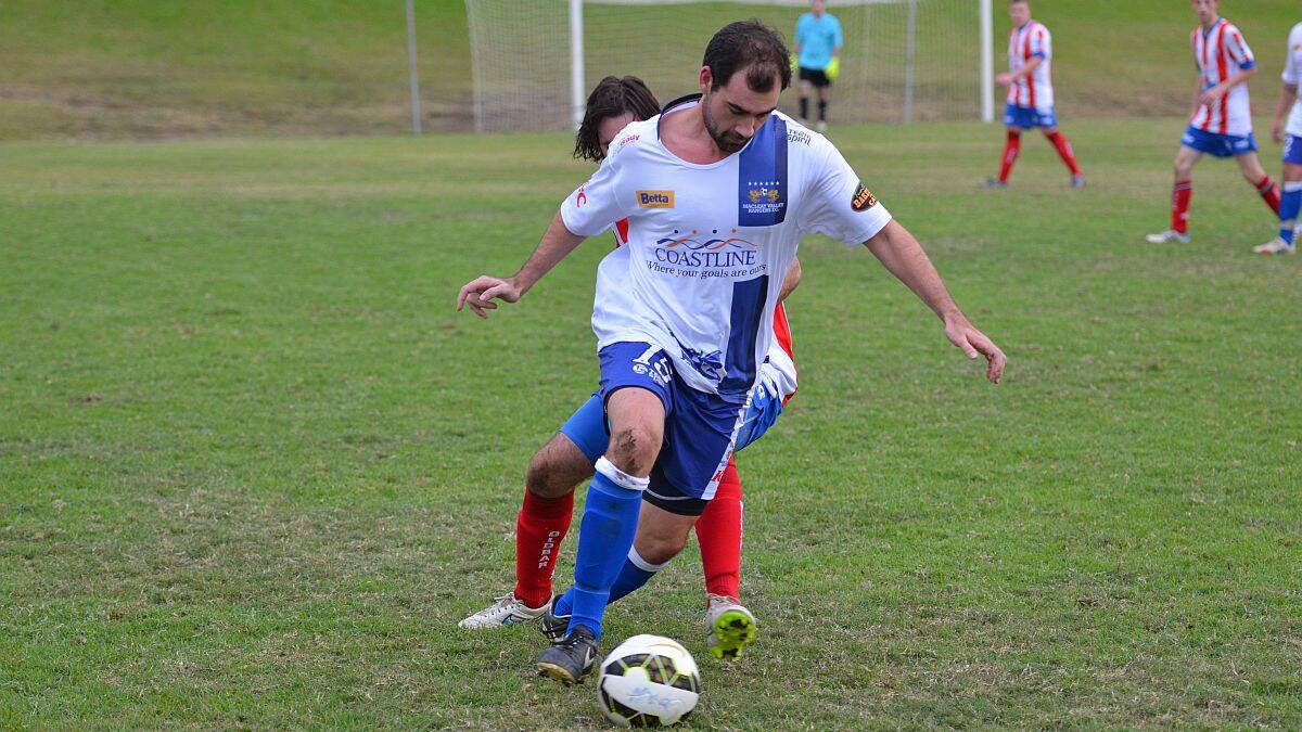 Local derby: Brent Ryan dribbles the ball for the Macleay Valley Rangers in their match against Old Bar a fortnight ago.