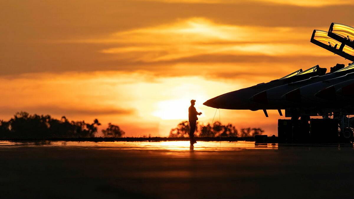 F/A-18F Super Hornets sit ready as the sun sets at RAAF Base Darwin. Australia should upgrade its air bases to allow further co-operation with US forces. Picture: Department of Defence