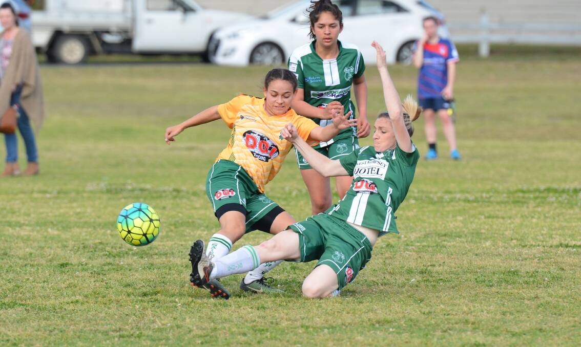 Chasing glory: Kempsey Saints Women's White side compete in a grand final against the Wauchope Waratahs on Saturady. Photo: Penny Tamblyn.