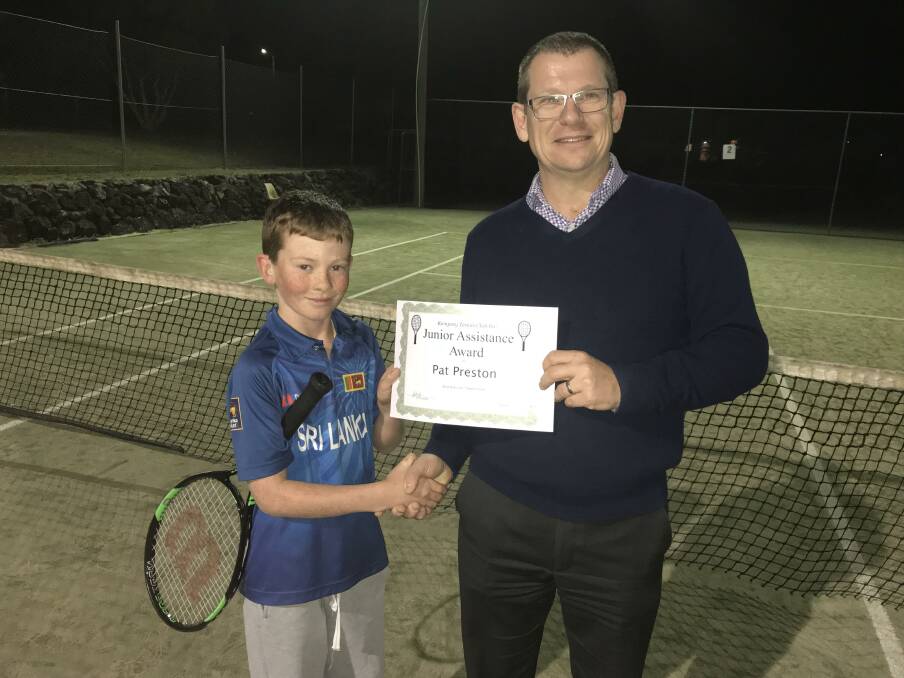 Little champion: Pat Preston being congratulated by Kempsey Tennis Club President Ben Bailey. Photo: Supplied.