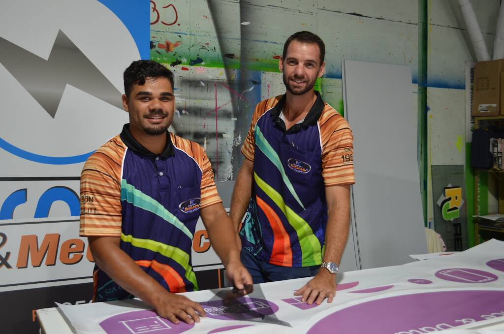 Hard work: Khalil Hammond (left) has excelled in his role working for Kempsey Signs owner Brent Stringer. Photo: Callum McGregor.