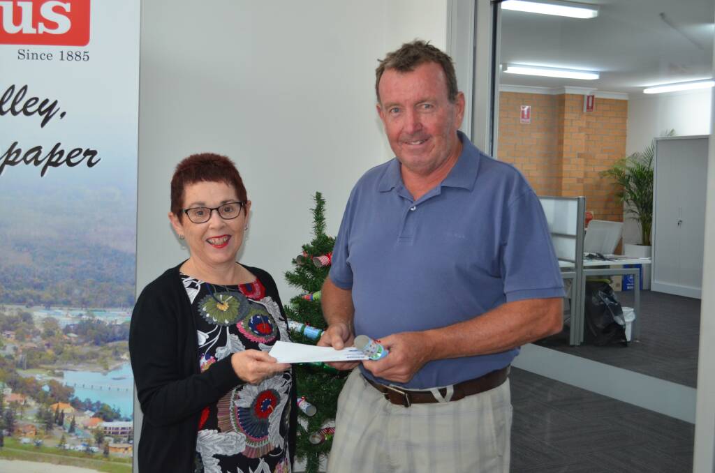 Macleay Argus employee Maureen Partridge with one of the lucky winners Kim Norberry.