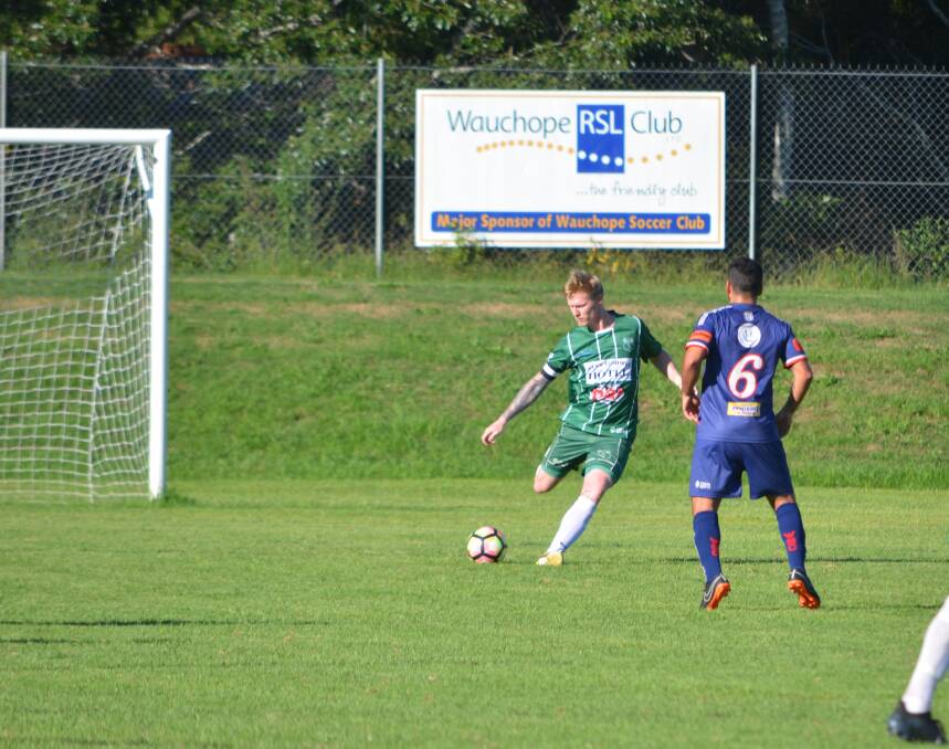 Clearance: Kempsey Saints defender Troy Ward clears the ball out of the danger zone against Wauchope earlier this year. Photo: Callum McGregor.