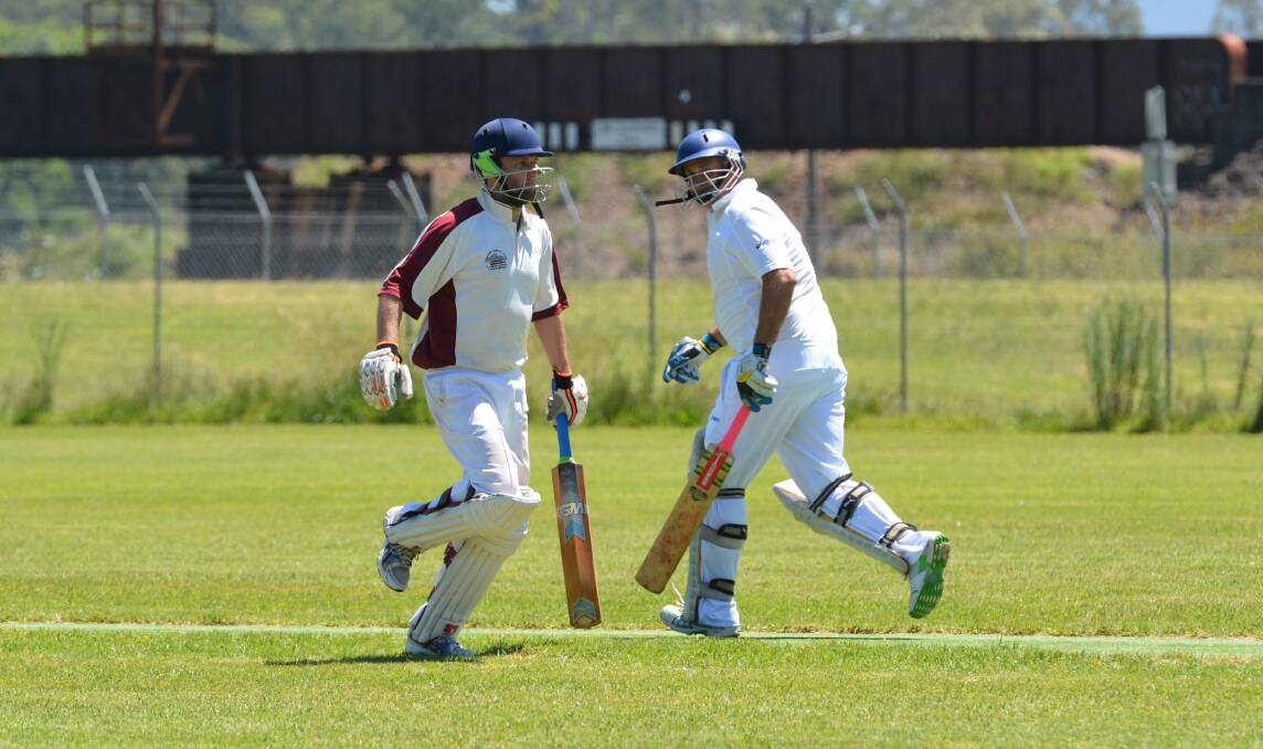 Runs there: Macleay Valley Cricket Association players run between the wickets in a match earlier this season. Photo: Penny Tamblyn.