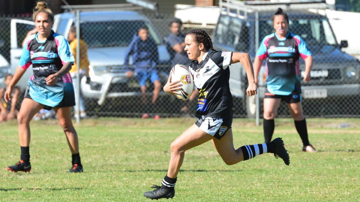 A Lower Macleay Magpies player carries the ball forward earlier this season against the South West Rocks Marlins. Photo: Penny Tamblyn