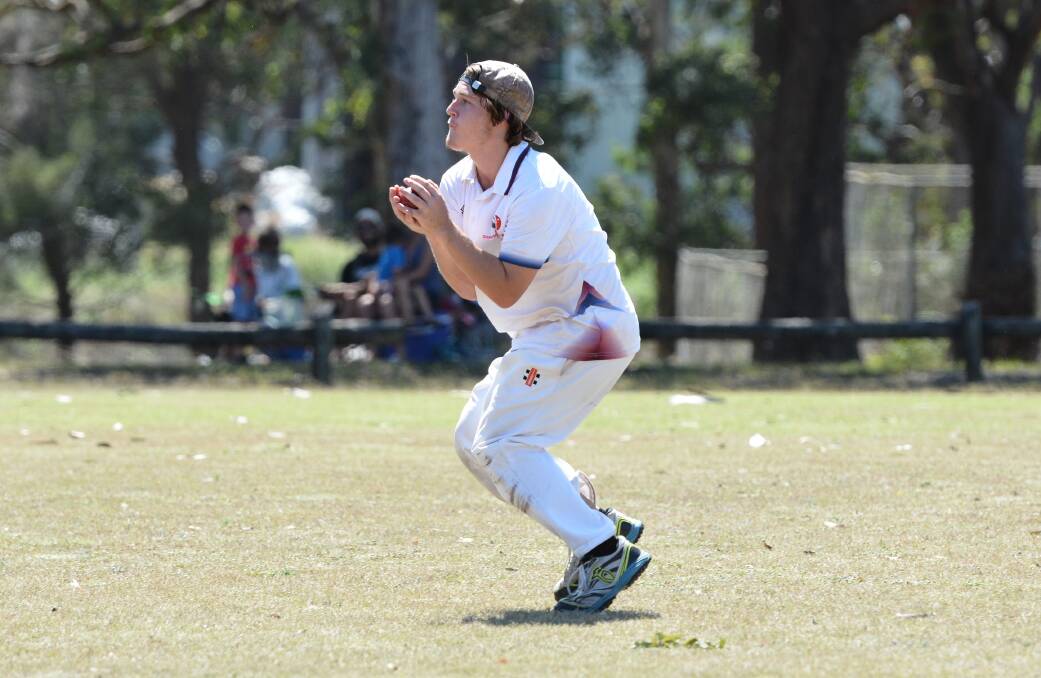 Sent packing: A Stuarts Point/Eungai cricket player makes a catch in the field. Photo: Penny Tamblyn.