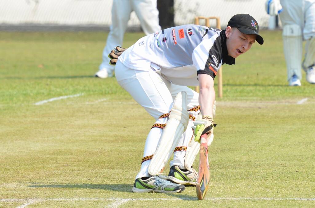 A Rovers first grade player reaches out to cross the crease. Photo: Penny Tamblyn