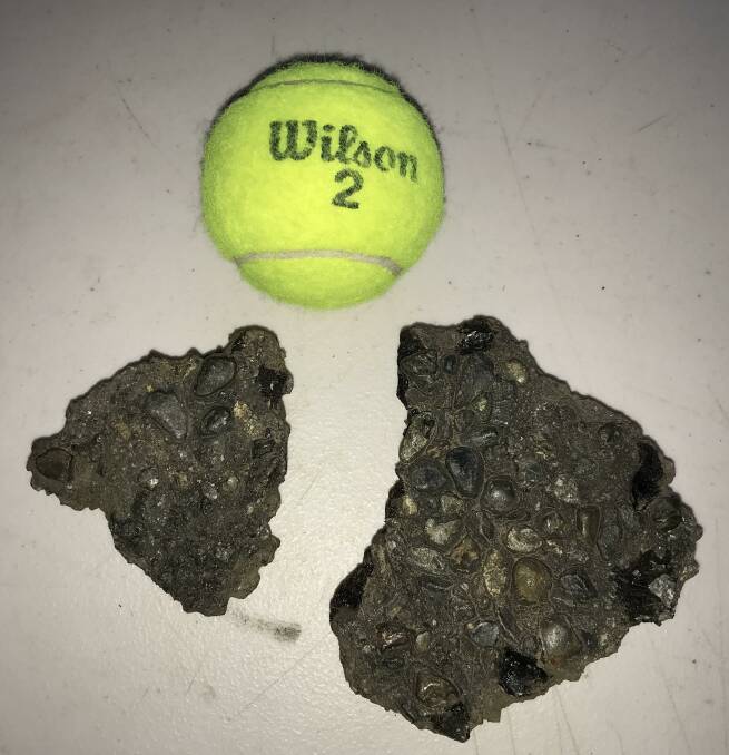 The two rocks Geoff Colton alleges were thrown at the tennis courts while the kids were training. The tennis ball gives an idea of the size of the stones.