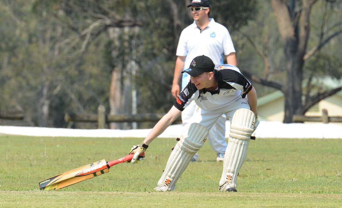 A Rovers batsmen reaches out to pass the crease when running between the wickets. Photo: Penny Tamblyn