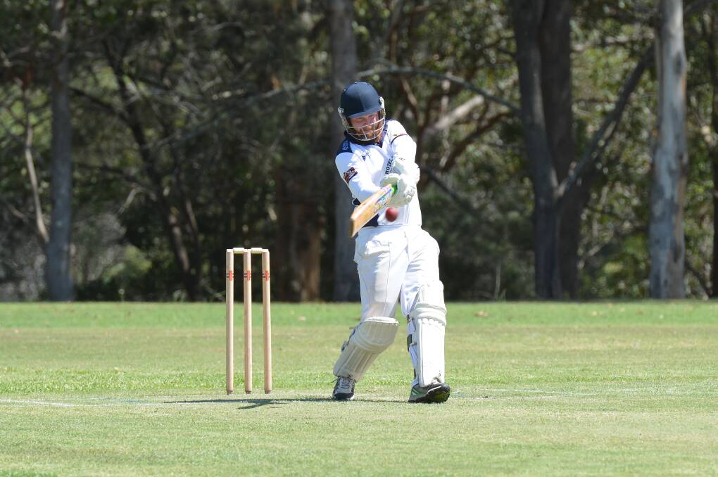 Shot: Dan Baker, who scored a team high 35 runs, connects with the ball against Macquarie on Saturday. Photo: Penny Tamblyn.