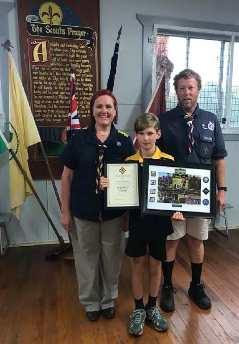 Honour: Kyle Bowman (centre) proudly shows off his Grey Wolf award. Photo: Supplied