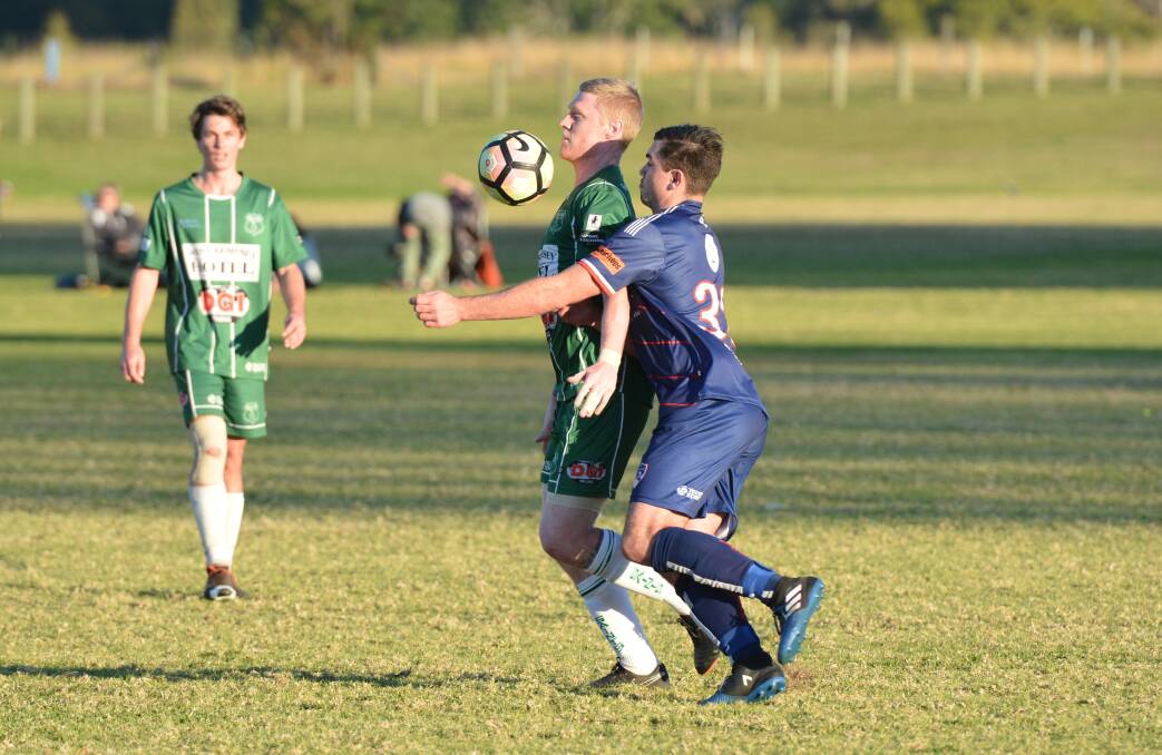 Skill: Troy Ward (pictured) controls the ball off his chest against Wauchope last season. Photo: Penny Tamblyn.