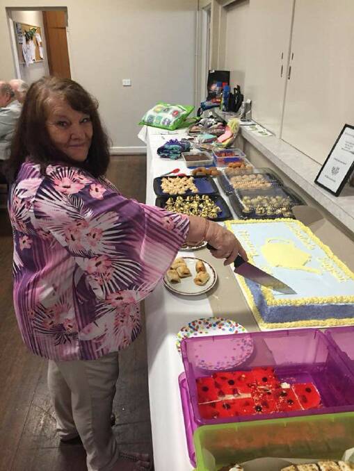 Aiming for a cancer free future: Brenda Elkington cutting the cake at the ABMT fundraiser. Photo: Supplied.