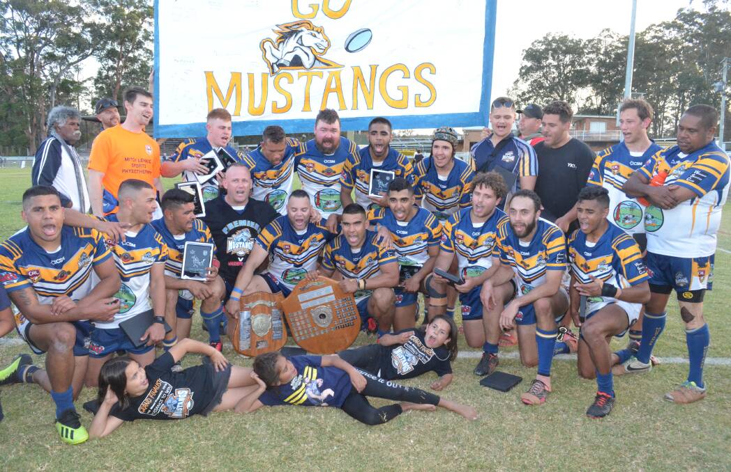 The Mustangs celebrate their grand final victory. Photo: Callum McGregor