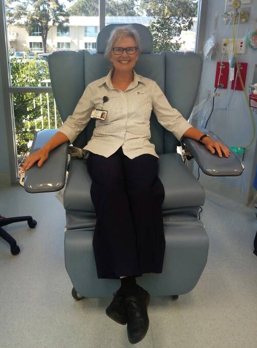 Nursing Unit Manager Jenny Baroutis in the new chemotherapy treatment chair donated by the North Coast Trucking Social Club.