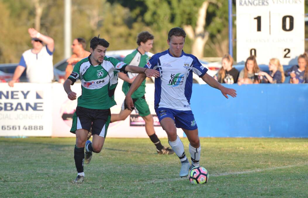 Control: Macleay Valley Rangers' Tyler Wyatt holds off a Port United defender earlier this season. Photo: Penny Tamblyn.