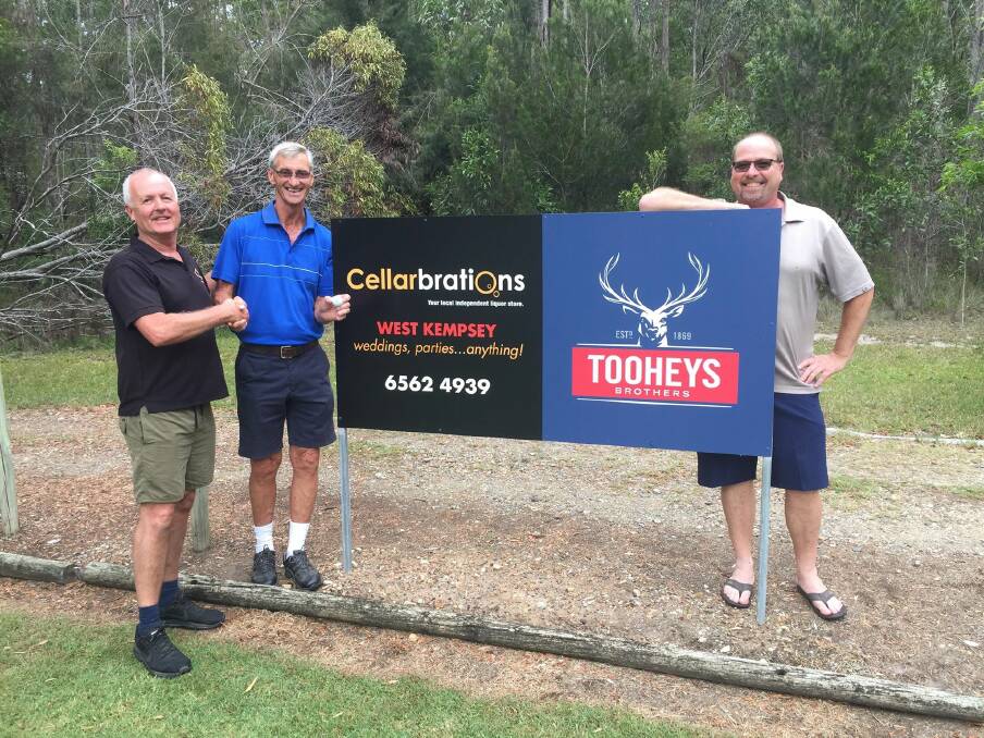 Kempsey Cellarbrations owner Simon Wetzler shakes the hand of Todd Watts who landed a hole-in-one and receives the $1,450 jackpot also with Kempsey Golf Club Pro Mike Richards.