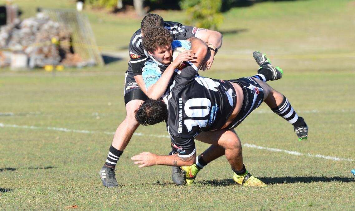 Wrestle: The Magpies attempt to tackle a Marlins player earlier this season. Photo: Penny Tamblyn.
