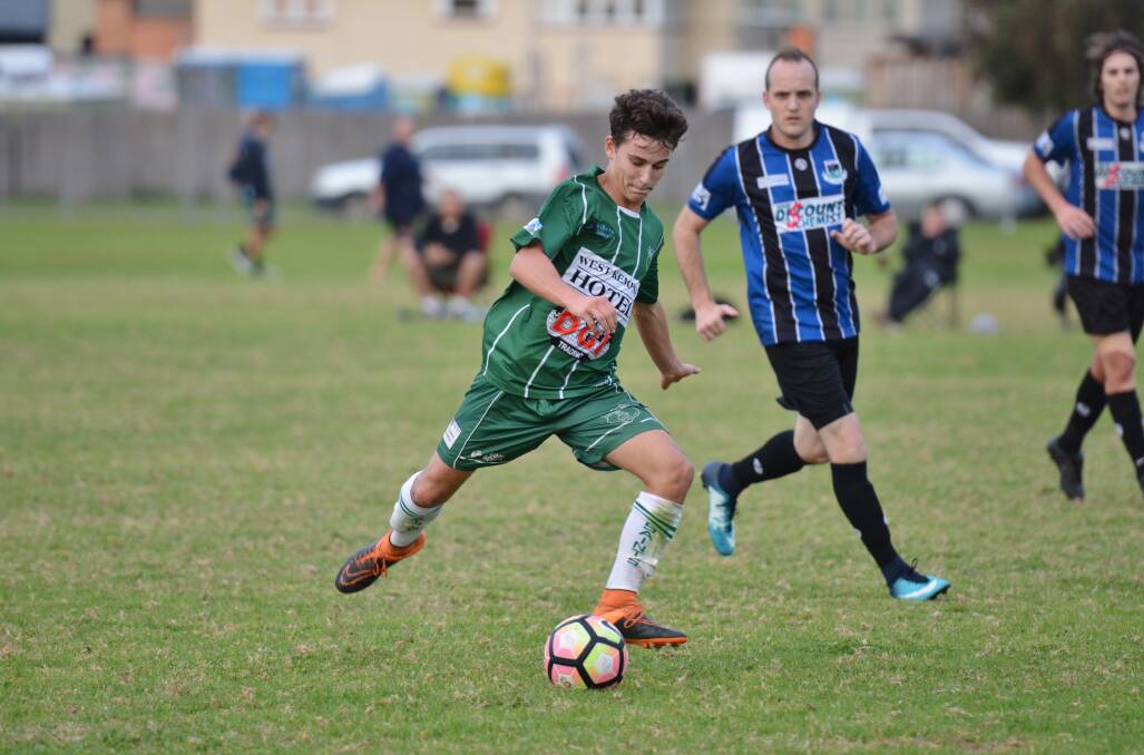 Preparing for contact: Liam King strikes the ball for the Kempsey Saints against Port Saints earlier this season. Photo: Penny Tamblyn.