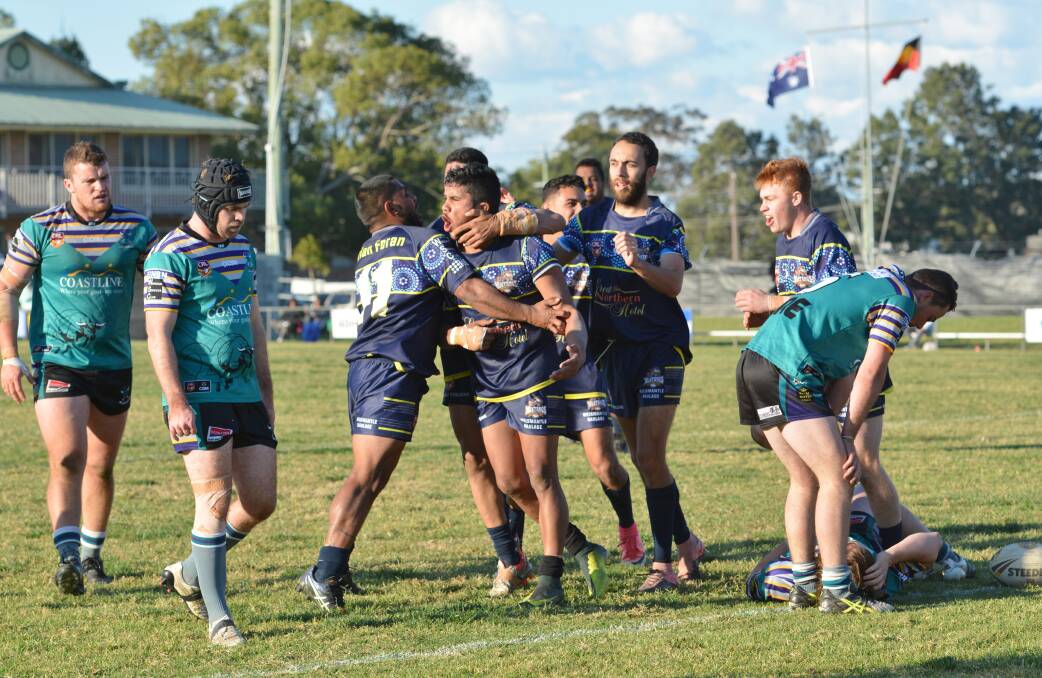 Euphoria: The Macleay Valley Mustangs celebrate a try to Stephan Blair in Saturday's preliminary final victory over the Taree City Bulls. Photo: Penny Tamblyn.