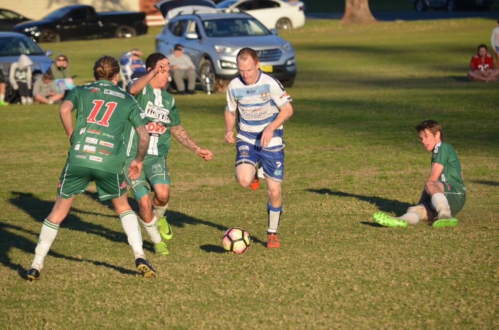 Bragging rights: The Macleay Valley Rangers held on for a 3-1 victory over 10-men Kempsey Saints who lost their captain Troy Ward in the first half to a red card. Photo: Tom Bushnell.