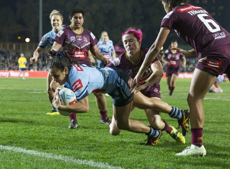 Nakia Davis-Welsh of the Blues scores during the Women's State of Origin match against Queensland Maroons at North Sydney Oval. (AAP Image/Craig Golding)