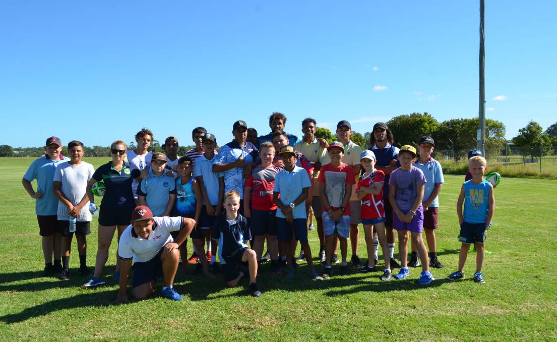 Star struck: Macleay junior rugby league players with Kempsey's NRL player Tyronne Roberts-Davis(centre, back). Photo: Callum McGregor.