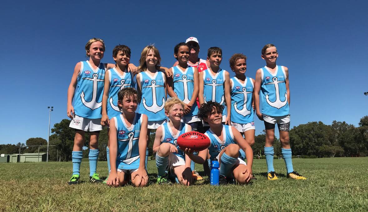 First game: The South West Rocks Dockers Under 11s team played their inaugural Aussie Rules game on Sunday. Photo: Supplied.