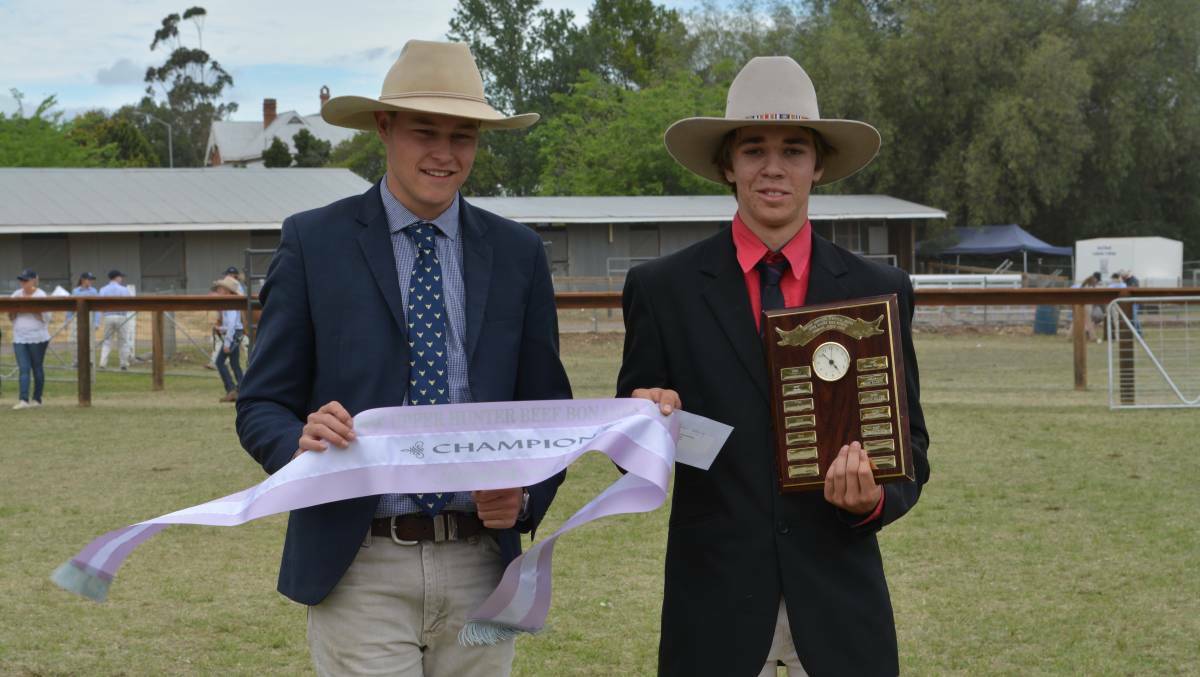 Overall grand champion junior judge Liam Whalen from Kempsey High School holds his trophy and sash presented by overjudge Jack Laurie from Knowla Livestock, Moppy.