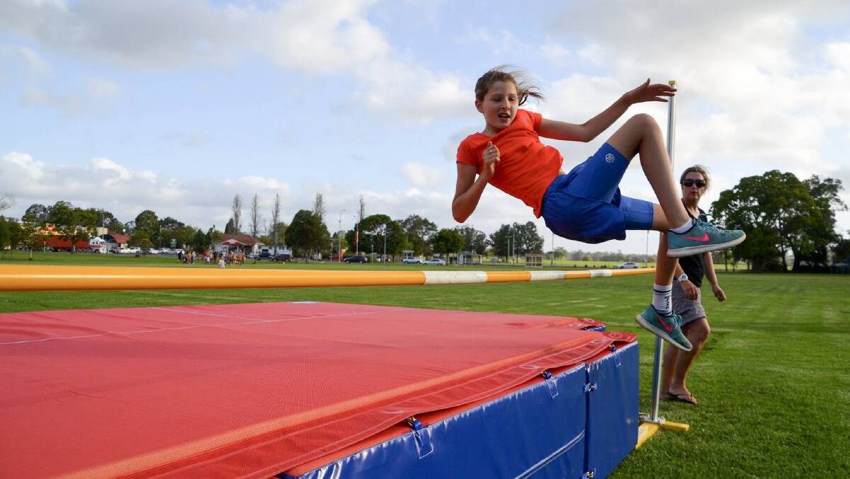 Leap: One of Kempsey Little Athletics' competitors Ruby Trappel clears the bar in high jump. Photo: Supplied.