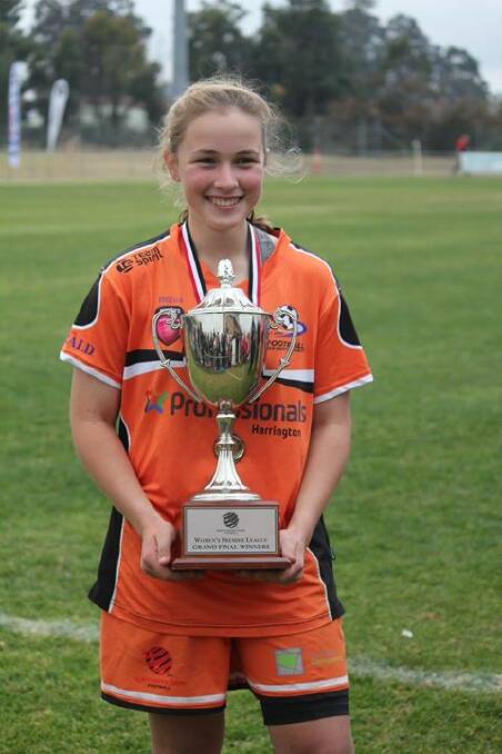 All smiles: Maddison Kerr with the premiership trophy after claiming the grand final 1-0. Photo: Crystal Hall.