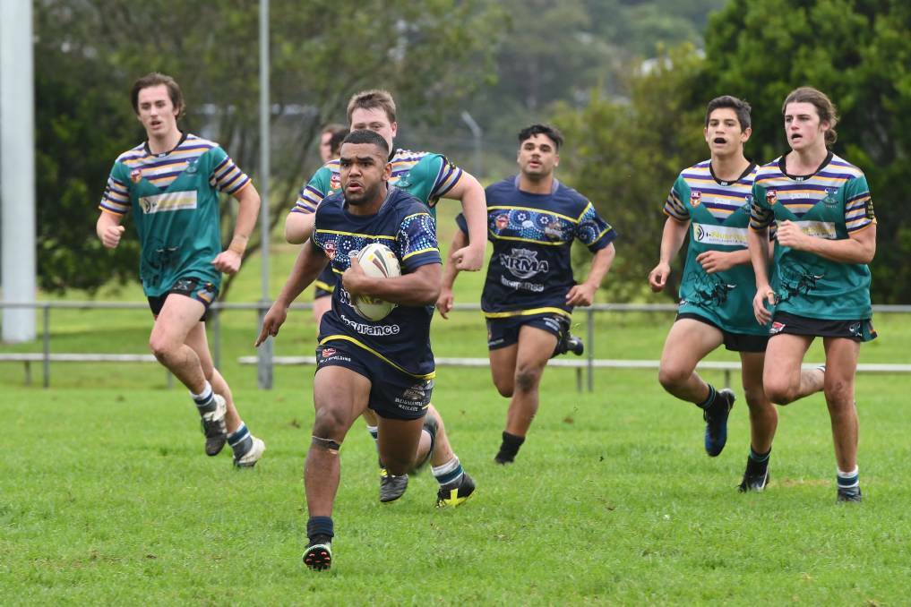Linebreak: Former Macleay Valley Mustangs U18.5s five-eighth William Lockwood Junior busts the defensive line against the Taree City Bulls. Photo: Penny Tamblyn.
